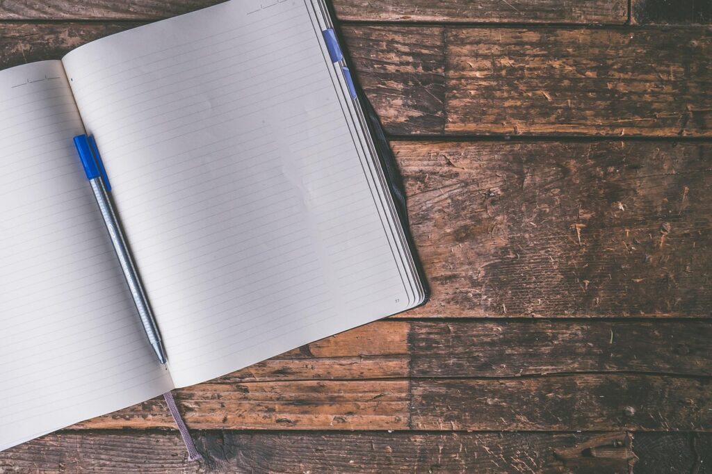 writing notebook laptop